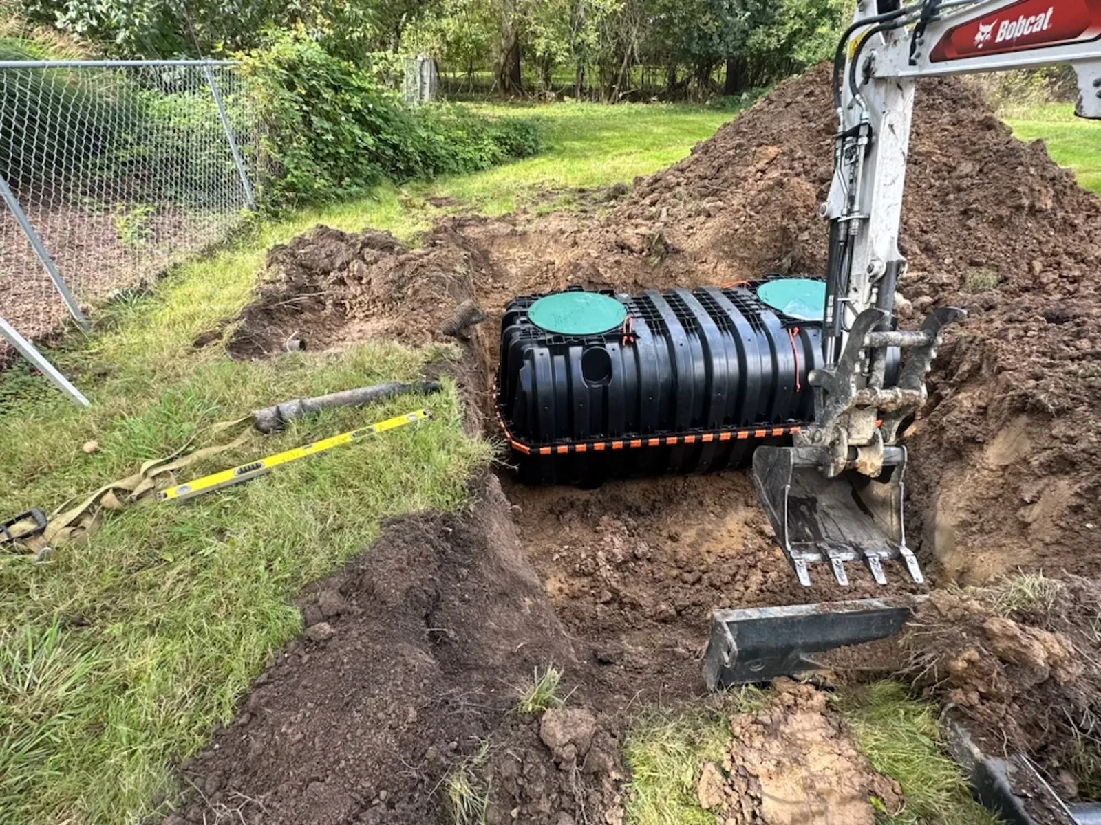 Septic tank set in an excavated pit during a septic system installation